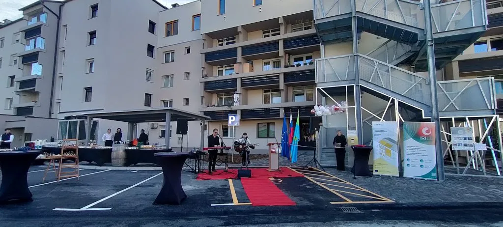 The façade and external staircase of the renovated Ob Suhi 19 apartment building